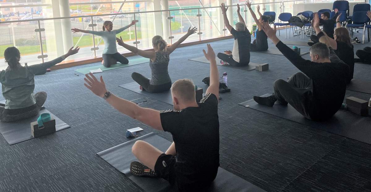 <p><strong>A moment of zen</strong><br>Employees taking advantage of the free on site yoga classes.</p>