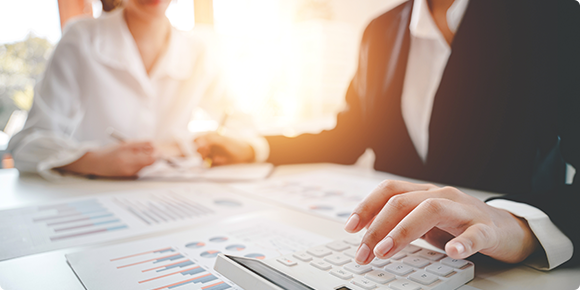 close-up of two people doing calculations